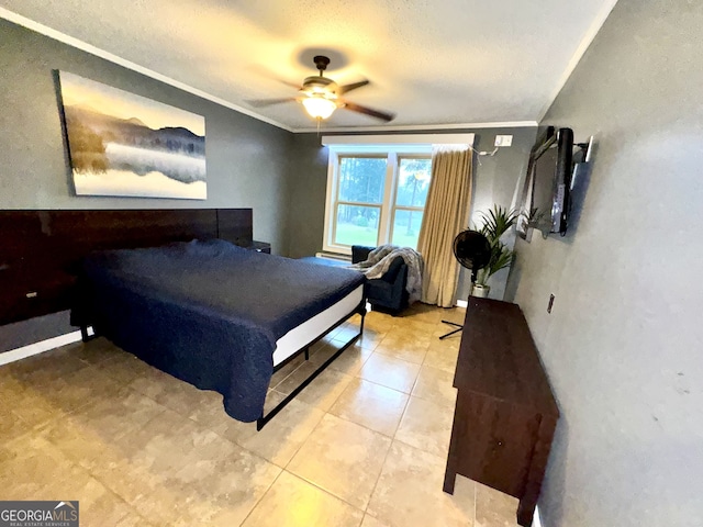 bedroom with tile patterned flooring, a textured ceiling, ornamental molding, and ceiling fan