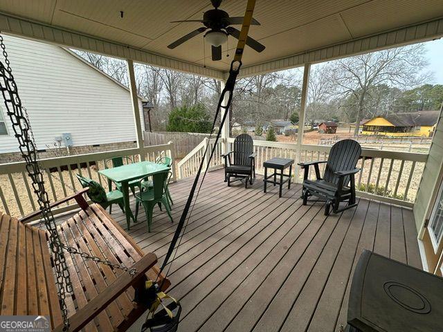 back of house with a porch and a lawn