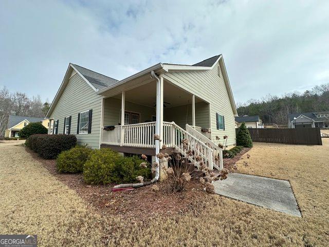 exterior space featuring a yard and covered porch