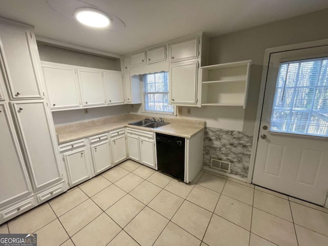 kitchen with black dishwasher, open shelves, light countertops, and white cabinetry