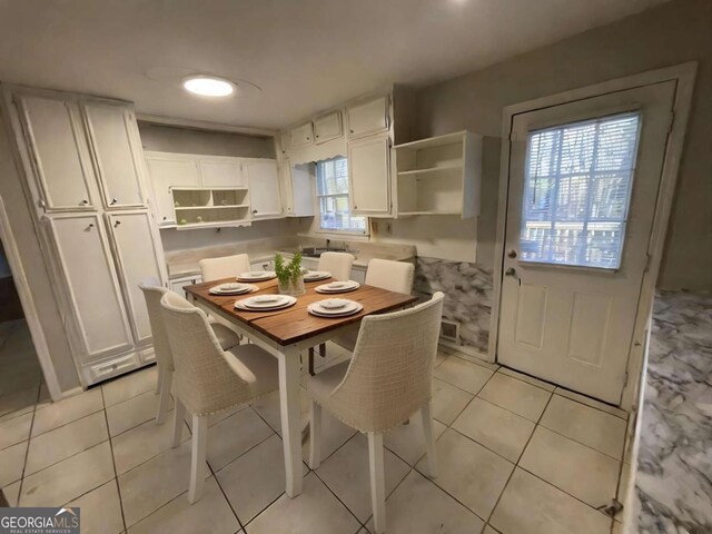 dining space with light tile patterned flooring