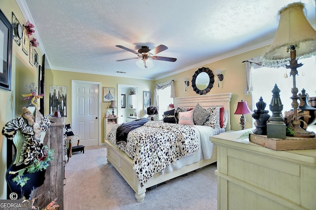 carpeted bedroom with ceiling fan, crown molding, and a textured ceiling