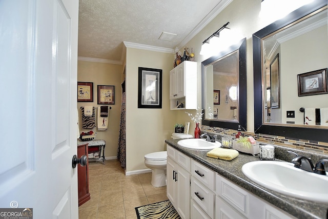 bathroom with toilet, crown molding, a textured ceiling, vanity, and tile patterned flooring