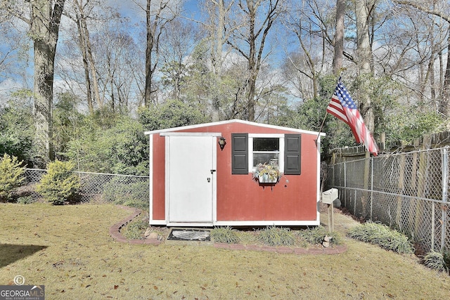 view of outbuilding with a yard