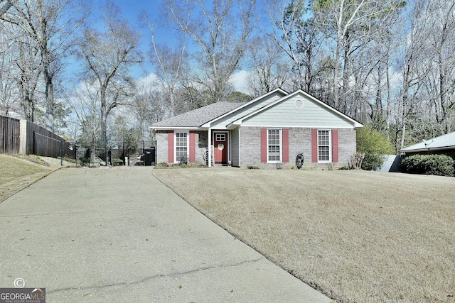 ranch-style home with a front yard