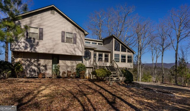 back of property with a mountain view