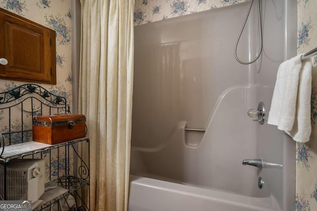 bathroom featuring shower / tub combo with curtain