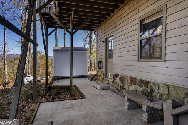 view of patio with a shed