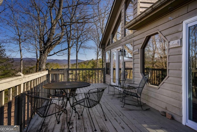 wooden deck featuring a mountain view