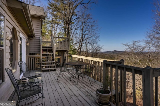 wooden deck with a mountain view