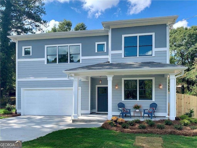 view of front of property featuring a garage and a porch