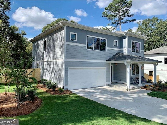 view of front of property featuring a garage, a porch, and a front yard