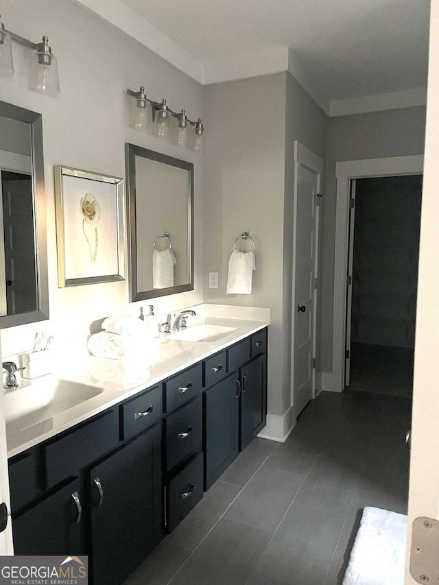 bathroom featuring vanity, ornamental molding, and tile patterned floors