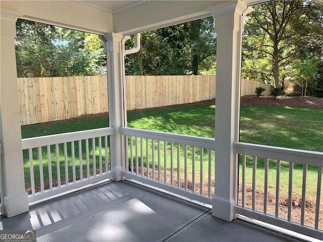 unfurnished sunroom featuring a wealth of natural light