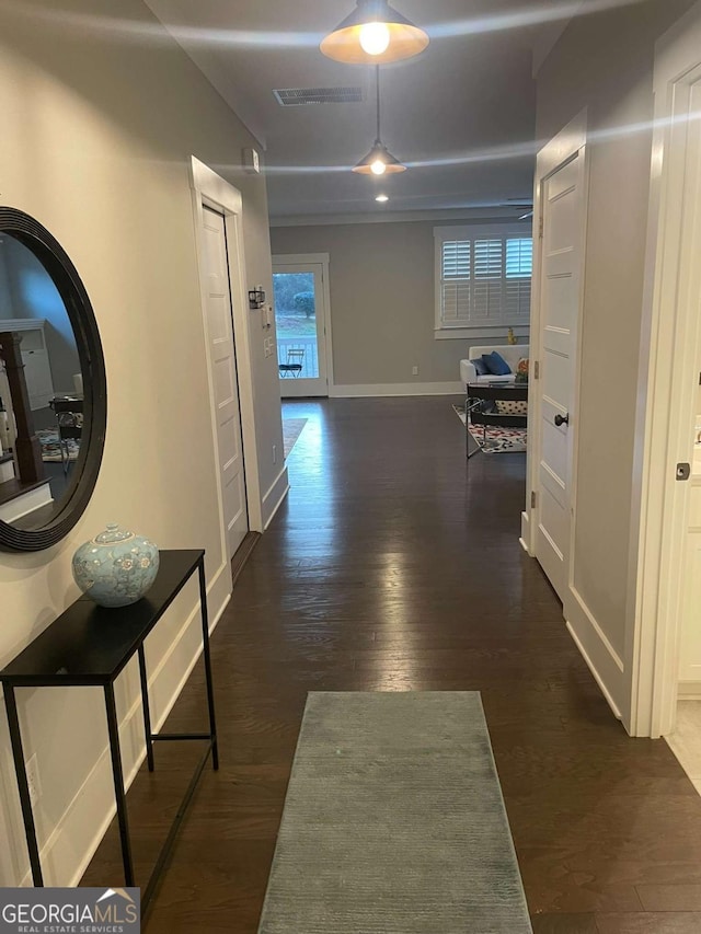 hallway featuring dark hardwood / wood-style floors