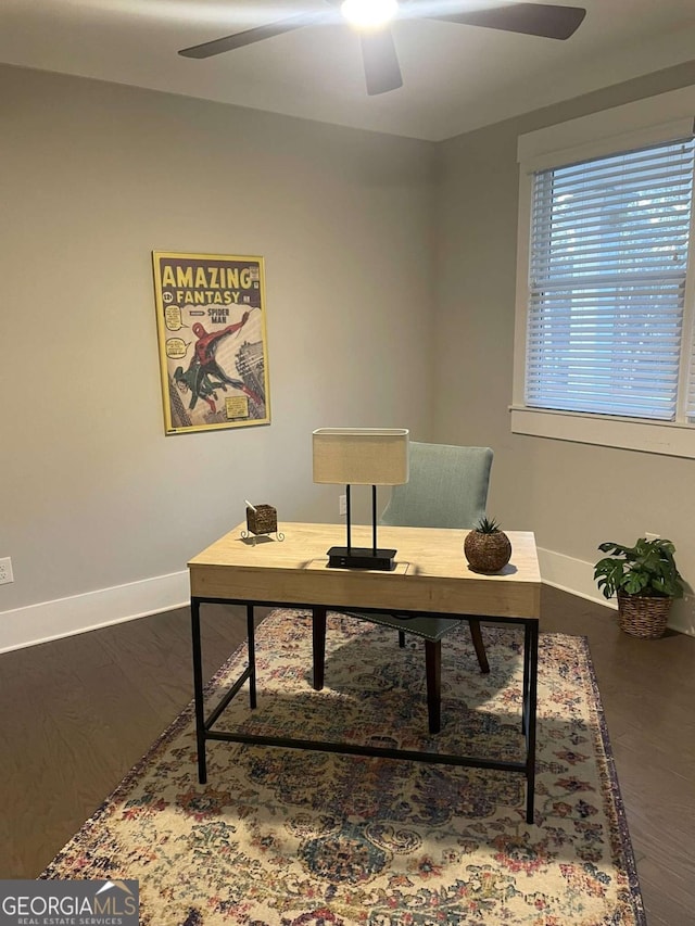 office area featuring dark wood-type flooring and ceiling fan