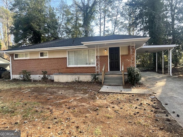 view of front of home featuring a carport