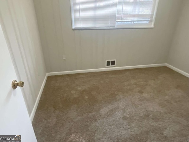 unfurnished room with carpet floors