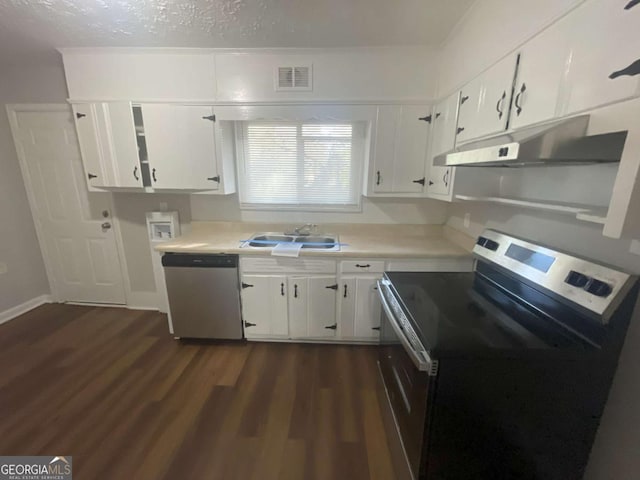 kitchen featuring appliances with stainless steel finishes, dark hardwood / wood-style flooring, sink, and white cabinets