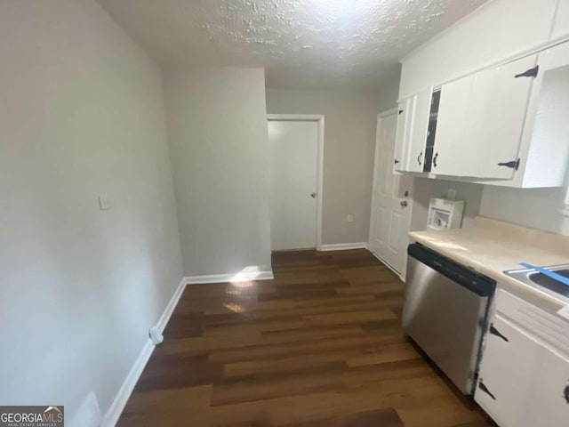 kitchen featuring a textured ceiling, dishwasher, dark hardwood / wood-style floors, and white cabinets