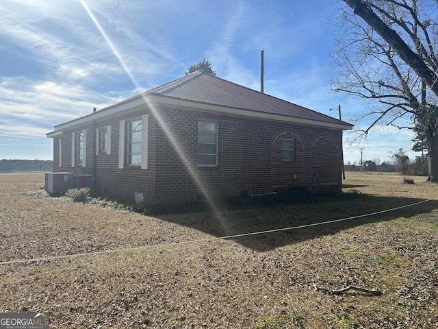 view of property exterior featuring central air condition unit