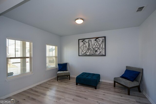 sitting room with light wood-type flooring