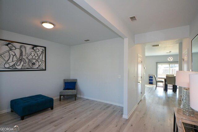 sitting room featuring light hardwood / wood-style floors