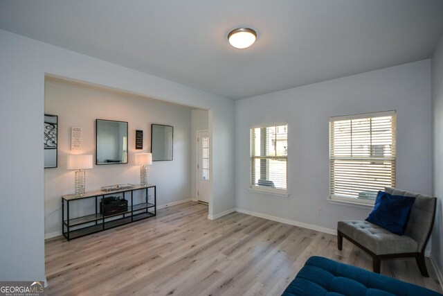 sitting room with light hardwood / wood-style floors