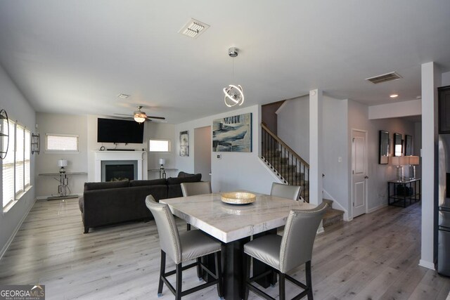 dining room featuring ceiling fan and light wood-type flooring