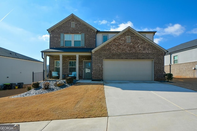 view of front of property with a garage and a porch