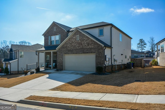 view of front of house featuring cooling unit and a garage