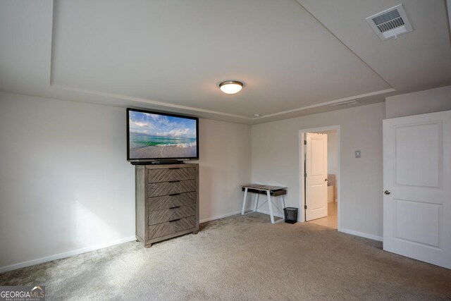 interior space featuring light carpet