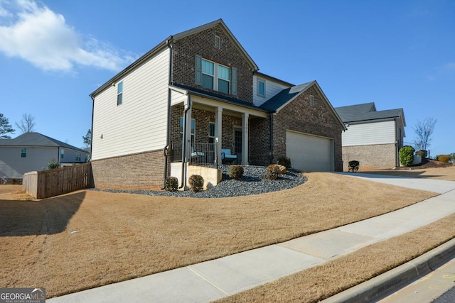 view of front facade with a garage and covered porch