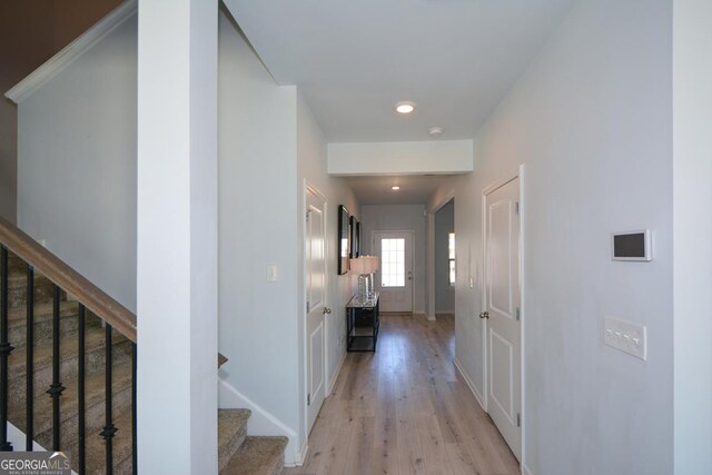 hallway with light wood-type flooring