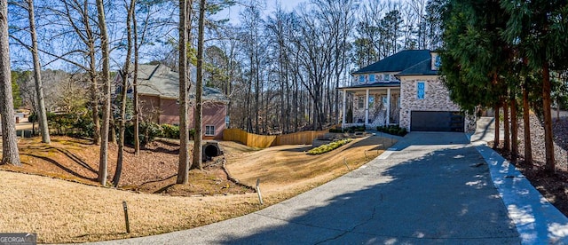 view of front of property with a garage and covered porch