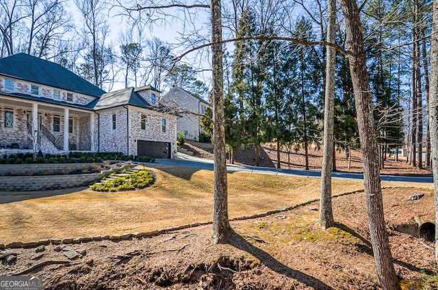 view of yard with a garage