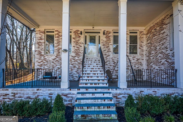 property entrance featuring covered porch