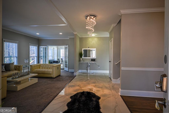 living room featuring ornamental molding and a chandelier