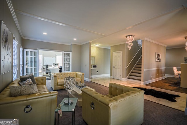 living room featuring crown molding and a chandelier