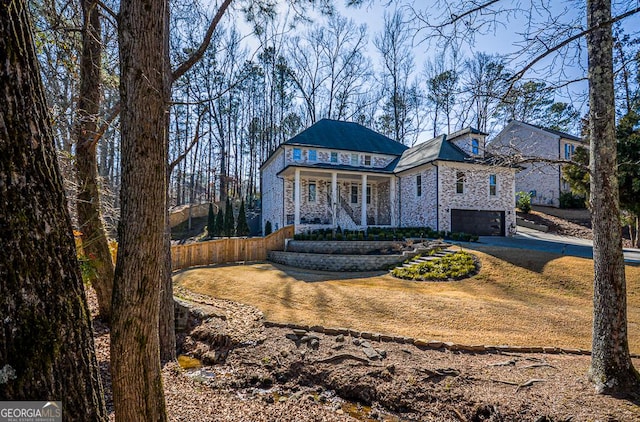 view of front of property with a garage and covered porch