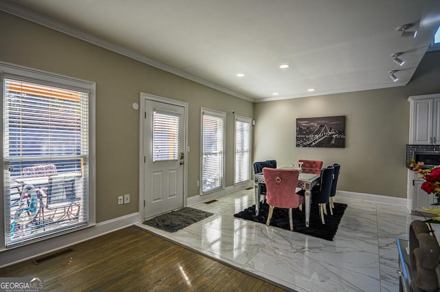 dining area with crown molding