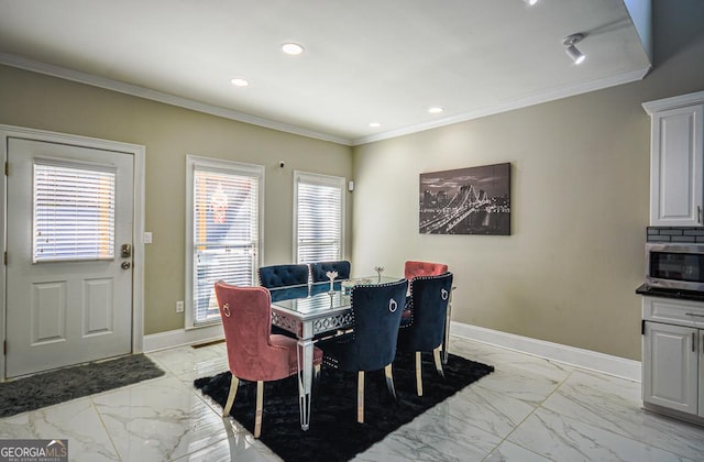 dining space with ornamental molding