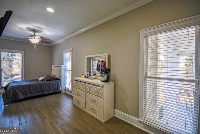 bedroom featuring crown molding and dark hardwood / wood-style floors