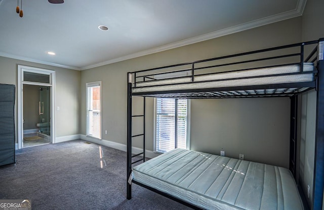 unfurnished bedroom with multiple windows, crown molding, and carpet