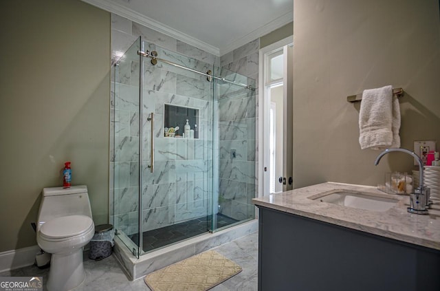 bathroom featuring crown molding, toilet, vanity, and a shower with shower door