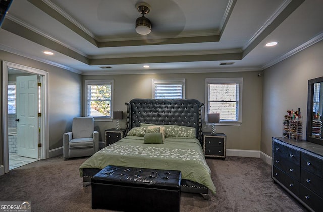 carpeted bedroom featuring crown molding, a raised ceiling, and ceiling fan