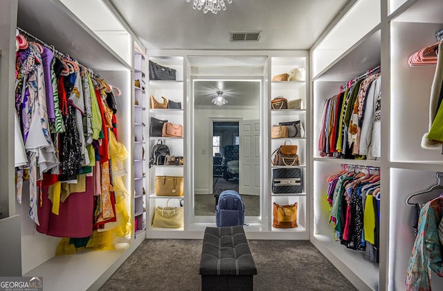 walk in closet featuring carpet