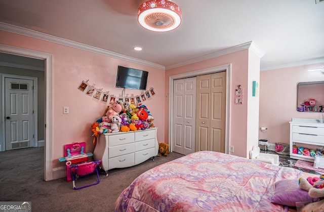 carpeted bedroom featuring crown molding and a closet