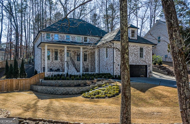 view of front facade with a porch and a garage