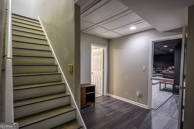 staircase with wood-type flooring